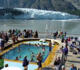 Passengers on Holland America, Zaadam enjoy the sunshine as she stands off th Margerie Glacier, Alaska